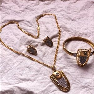 One necklace, earrings and a bracelet